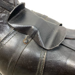 Load image into Gallery viewer, Close-up of a black leather boot with a buckle on a white background
