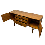 Load image into Gallery viewer, Wooden sideboard with open doors and drawers on a white background
