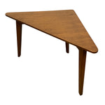 Load image into Gallery viewer, A mid-century modern triangular wooden table with a warm medium-brown finish and tapered legs, shown on a plain white background.
