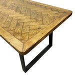 Load image into Gallery viewer, Wooden table with parquet pattern and black metal legs on a white background
