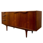 Load image into Gallery viewer, Mid-century modern wooden sideboard with three drawers on the left and three large doors on the right, finished in warm reddish-brown wood with curved drawer and door pulls, shown on a plain white background.

