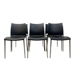 Load image into Gallery viewer, six black leather chairs in two rows on a white background
