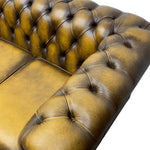 Load image into Gallery viewer, Close-up of a brown leather sofa with tufted backrests on a white background
