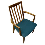 Load image into Gallery viewer, A mid-century modern wooden armchair with a slatted backrest, curved wooden armrests, and a teal blue upholstered seat cushion, shown on a plain white background.
