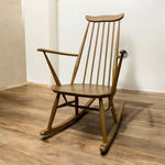 Load image into Gallery viewer, Rocking chair on a wooden floor
