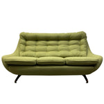 Load image into Gallery viewer, A mid-century modern three-seat sofa upholstered in olive green fabric, featuring a tufted backrest, curved arms, and black metal legs, shown against a plain white background.
