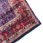 Load image into Gallery viewer, Close-up of a patterned rug with red, blue, and beige colors on a white background
