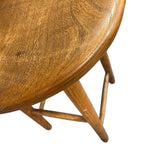 Load image into Gallery viewer, Wooden table with a focus on the top surface and legs.
