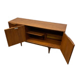 Load image into Gallery viewer, Mid-century modern wooden credenza or media console with two doors swung open, showing the interior shelving, on a plain white background.
