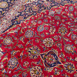 Load image into Gallery viewer, Close-up of a red floral patterned fabric
