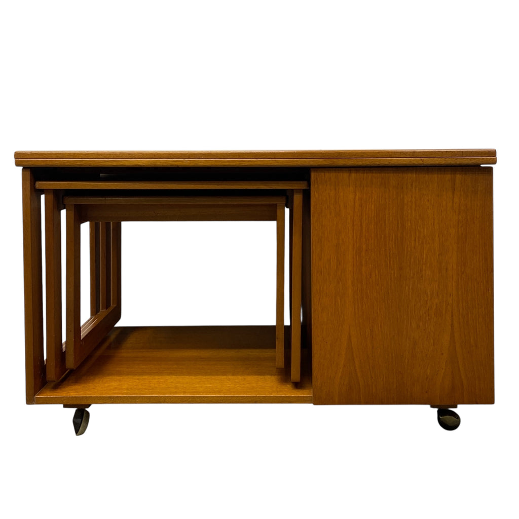 Set of wooden nesting tables on wheels with a white background