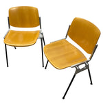 Load image into Gallery viewer, Two wooden chairs with metal frames on a white background
