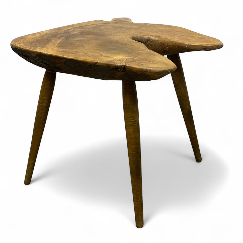 Wooden side table with a natural, rustic finish on a white background