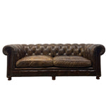 Load image into Gallery viewer, A classic Chesterfield loveseat sofa upholstered in distressed dark brown leather, featuring deep button tufting, rolled arms, and two loose seat cushions, shown against a plain white background.
