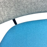 Load image into Gallery viewer, Close-up of a blue and gray cushioned chair with a white trim.
