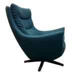 Load image into Gallery viewer, Blue armchair with a wooden base on a white background
