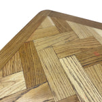 Load image into Gallery viewer, Close-up of a triangular wooden board or tray with a geometric parquet-style wood pattern in mixed natural tones, shown against a white background.
