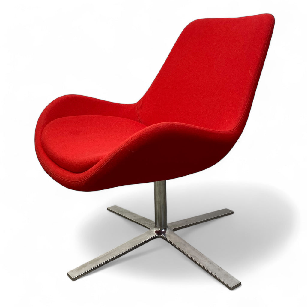 Red chair with a metal base on a white background