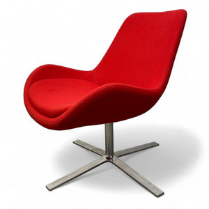 Red chair with a metal base on a white background