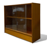 Load image into Gallery viewer, Wooden display cabinet with glass front on a white background
