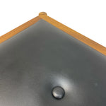 Load image into Gallery viewer, Black leather surface with a wooden border and central button on a white background
