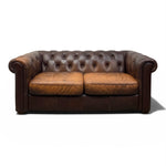 Load image into Gallery viewer, Brown leather sofa on a white background
