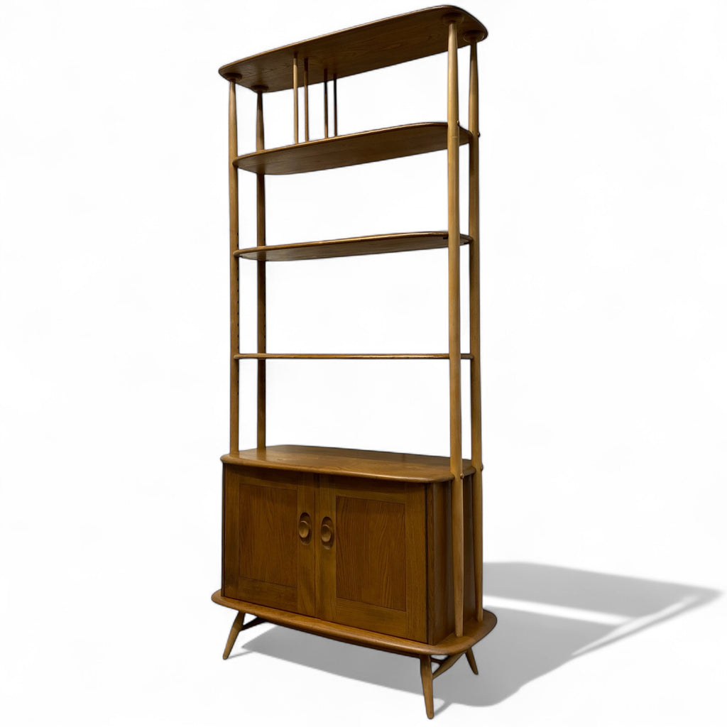 Wooden bookshelf with multiple shelves on a white background