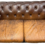 Load image into Gallery viewer, Brown leather sofa with visible wear and tear on a white background
