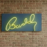 Load image into Gallery viewer, Neon sign with a logo on a brick wall
