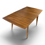 Load image into Gallery viewer, A modern rectangular wooden dining table with a rich grain pattern, tapered legs, and rounded corners, shown from an elevated perspective on a white background.
