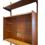 Load image into Gallery viewer, Wooden bookshelf with glass shelves on a white background
