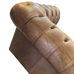 Load image into Gallery viewer, Close-up of a tufted leather armrest in a warm medium brown color, showing the texture and stitching details against a plain white background.
