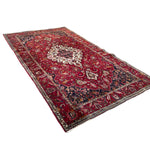 Load image into Gallery viewer, Decorative red and black patterned rug on a white background
