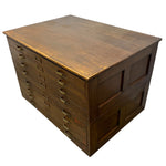 Load image into Gallery viewer, A vintage wooden multi-drawer cabinet with a warm brown finish, featuring brass handles and drawer pulls, photographed on a white background.
