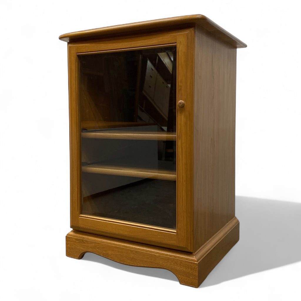 Wooden cabinet with glass door on a white background