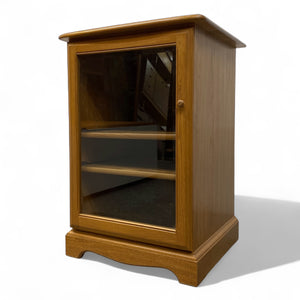 Wooden cabinet with glass door on a white background