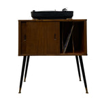 Load image into Gallery viewer, Mid-century modern wooden record player cabinet with black legs and brass feet, holding a black turntable, on a white background.
