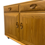 Load image into Gallery viewer, Wooden sideboard with drawers and doors on a white background
