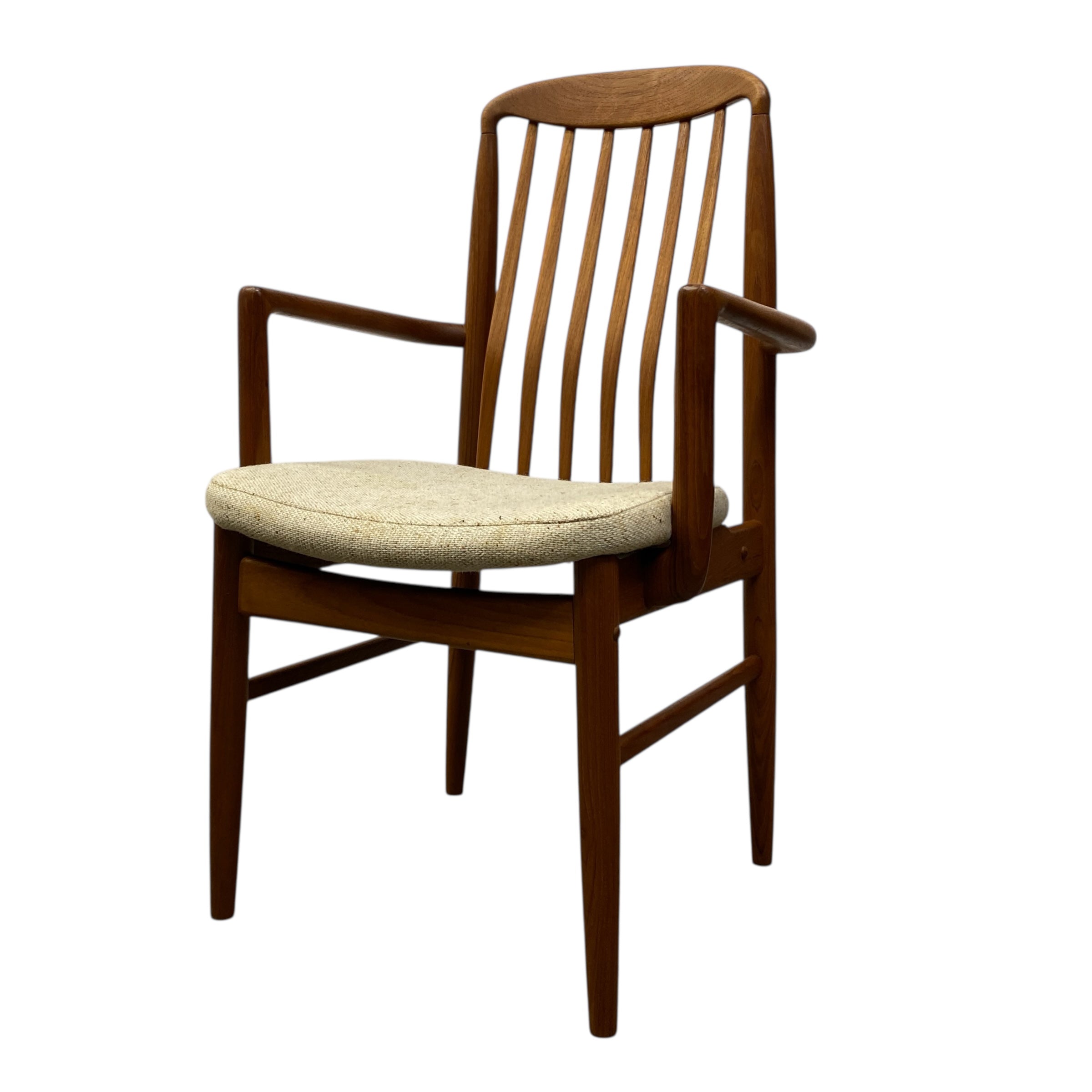 Wooden chair with a cushioned seat on a white background