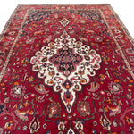 Load image into Gallery viewer, Decorative red rug with intricate patterns on a white background
