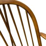 Load image into Gallery viewer, Close-up of a wooden chair back showing curved spindle-style slats and a warm medium-brown wood finish against a plain white background.
