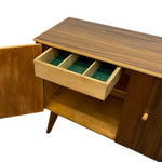 Load image into Gallery viewer, Mid-century modern wooden sideboard cabinet with a dark wood grain finish, an open door on the left, and a drawer pulled out to show green felt-lined compartments, photographed on a white background.
