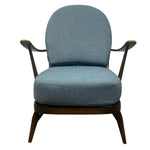 Load image into Gallery viewer, Blue upholstered armchair with dark wooden frame on a white background
