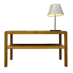 Load image into Gallery viewer, Wooden side table with a lamp on a white background
