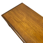 Load image into Gallery viewer, A close-up of a wooden tabletop with a warm medium-brown finish and visible wood grain, photographed on a plain white background.
