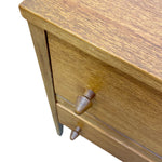 Load image into Gallery viewer, Close-up of a wooden furniture piece showing the top surface, drawer front, and metallic drawer pulls on a white background.
