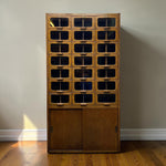 Load image into Gallery viewer, HABERDASHERY WITH TWENTY ONE DRAWERS ON A WOODEN FLOOR
