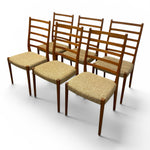 Load image into Gallery viewer, Set of six wooden chairs with beige cushioned seats on a white background
