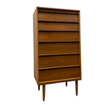 Load image into Gallery viewer, Mid-century modern wooden chest of drawers with five drawers and tapered legs, shown on a plain white background.
