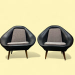 Load image into Gallery viewer, Two black armchairs with gray cushions on a beige background

